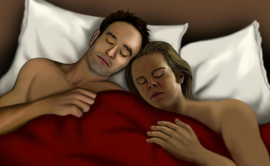 Matt Murdock and Foggy Nelson in bed together, both asleep with their eyes shut. Only their bare shoulders and faces are visible, on cream pillows, with a deep red blanket pulled up. They each have their outer arm on top of the blanket and their heads are leaning in together on the pillows, resting against each other. The background is dark brown