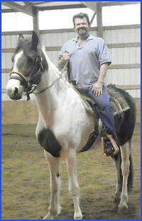 B.G. Thomas on horseback