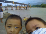 Stephen and Miguel at the temporary bridge in Botolan