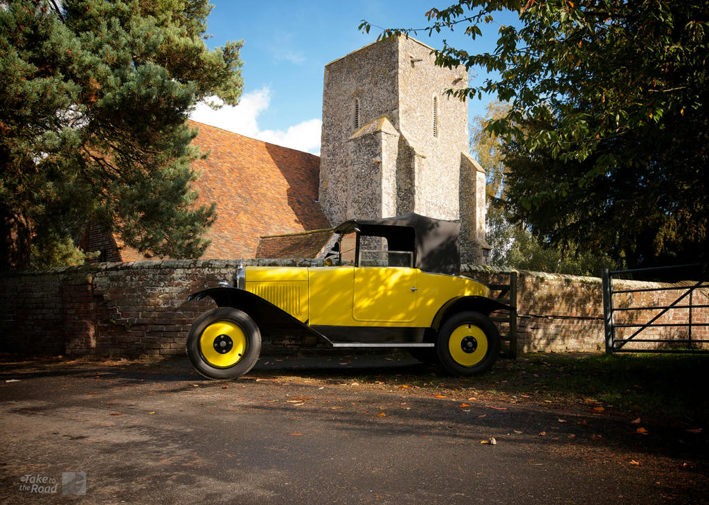 Citroen 5CV parked outside an old church