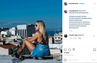 Female person passively holding a skateboard